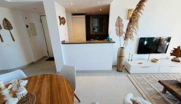 Resa Estates Ibiza Cala Tarida sea views apartment te koop living and kitchen.jpeg
